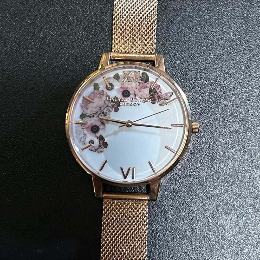 OLIVIA BURTON WATCH WITH 38mm WHITE MULTICOLOR FLORAL PATTERN FACE.